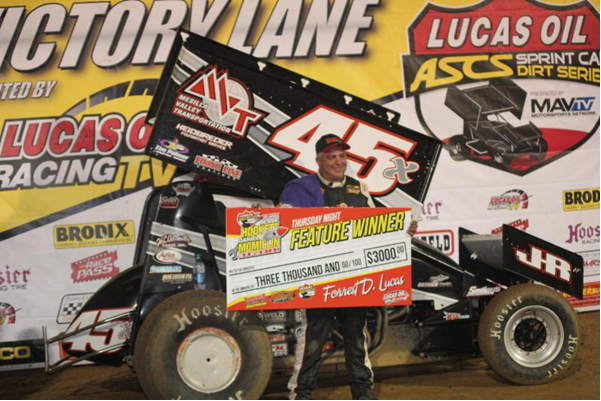 Johnny Herrera in victory lane after scoring the ASCS feature win on Night One of the Hockett/McMillin Memorial at Lucas Oil Speedway. (CB Race Photos)
